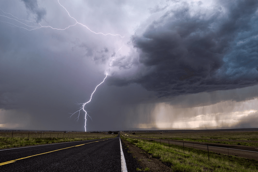 Lightning storm over an open road